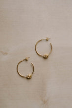 Load image into Gallery viewer, Flower knot hoops, gold hoop earrings, dainty gold hoops, star knot hoops, unique hoops, boho hoops, stacking hoops, medium hoops
