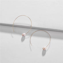 Load image into Gallery viewer, Brass wire pearl earrings, baroque pearl, circle earring, large, statement pearls, brass, wire earring, unique, avant garde, bridal, wedding